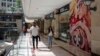 People walk in a shopping mall in Ankara, Turkey, Aug. 15, 2018. Turkey announced increased duties on U.S. products, including cars, tobacco and alcohol, on Wednesday in retaliation against U.S. sanctions and tariffs on Turkey in a continuing feud over the detention of an American pastor.