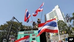 FILE - Anti-government protesters block the main gate of the Ministry of Natural Resources during a rally in Bangkok, Jan. 21, 2014. 