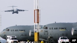 FILE - U.S. military planes are seen at Manas airbase outside Bishkek, Kyrgyzstan, Feb. 12, 2009.