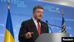 FILE - Ukrainian President Petro Poroshenko speaks to the media during a news conference in Kyiv.