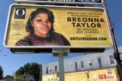 A billboard sponsored by O, The Oprah Magazine, is on display with a photo of Breonna Taylor, in Louisville, Kentucky, Aug. 7, 2020.