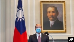 US Health and Human Services Secretary Alex Azar speaks during a meeting with Taiwan's President Tsai Ing-wen, unseen, in front of a portrait of Sun Yat-sen, who is widely regarded as the founding father of modern China, in Taipei, Taiwan, Aug. 10, 2020.