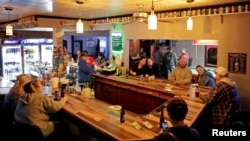 Club Ritz reopens to patrons following the Wisconsin Supreme Court's decision to strike down Governor Tony Evers' safer-at-home order against coronavirus disease (COVID-19) in Kaukana, Wisconsin, May 13, 2020. 