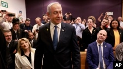 Israeli Prime Minister Benjamin Netanyahu arrives at a court hearing in his long-running trial for alleged corruption, in Tel Aviv, Israel, on Dec. 10, 2024.