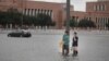 Grant Lu (L) and Naomi Pringle stand in a flooded parking lot on the campus of Rice University afer it was inundated with water from Hurricane Harvey on Aug. 27, 2017 in Houston, Texas. 