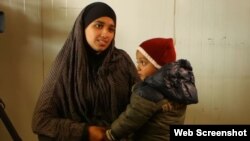 FILE - Hoda Muthana is seen with her son is this undated photo.