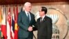 U.S. Vice President Mike Pence (L) is greeted by former ASEAN Secretary-General Le Luong Minh.