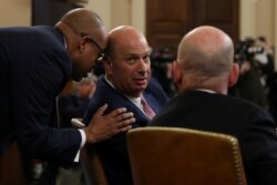 U.S. Ambassador to the European Union Gordon Sondland talks to his his lawyer while testifying at a House Intelligence Committee hearing as part of the impeachment inquiry into U.S. President Donald Trump on Capitol Hill in Washington.