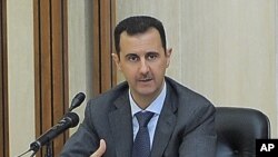 In this photo taken by the Syrian official news agency SANA, Syrian President Bashar Assad addresses a meeting for the central committee of the Baath party in Damascus, Syria, August 17, 2011