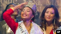 Tenzin Paldon, 21, reacts after winning the 2017 Miss Tibet beauty pageant at the Tibetan Institute of Performing Arts in Dharmsala, India, June 4, 2017.
