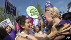 Abortion rights supporters cheer Supreme Court ruling Monday that strikes down a Texas abortion law. (AP Photo/J. Scott Applewhite)