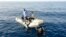 ATTENTION EDITORS - VISUAL COVERAGE OF SCENES OF INJURY OR DEATHMembers of Libya's coast guard recover the body of a migrant who drowned off Tripoli's coast, August 23, 2014. A wooden boat carrying up to 200 migrants has sunk just one kilometre (half a mi