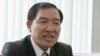 File - Duong Chi Dung, a former executive of a Vietnamese state-owned shipping firm who made a confession as a witness at his younger brother's trial this week, at his former office, Hanoi, 2007.