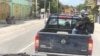 Cars are stopped on the road at Gressiers, Haiti.