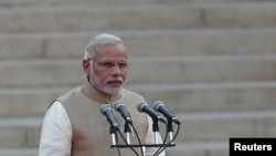FILE - India's Prime Minister Narendra Modi takes his oath at the presidential palace in New Delhi May 26, 2014