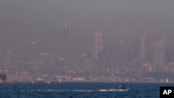FILE - A thick blanket of smoke hangs over parts of Sydney, Sept. 14, 2023. On Sept. 19, 2023, Sydney experienced its first total fire ban in almost three years and several schools on the New South Wales state South Coast were closed because of a heightened wildfire danger 