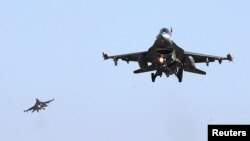 U.S. Air Force F-16 fighter jets fly over the Osan Air Base in Pyeongtaek, South Korea, December 4, 2017. Oh Jang-hwan/News1 via REUTERS 
