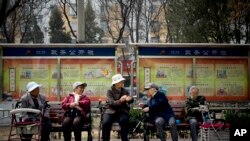 A group of elderly women rest in their wheelchairs at a residential compound in Beijing, China.