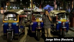 A tuk tuk driver waits for customers at Khaosan Road as tourism has decreased after coronavirus outbreak in Bangkok, Thailand March 12, 2020. REUTERS/Jorge Silva