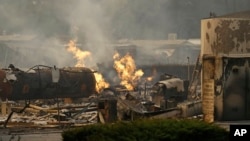 Natural gas burns from an open valve at the Journey's End mobile home park on, Oct. 9, 2017, in Santa Rosa, California.