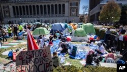 A sign sits erected at the pro-Palestinian demonstration encampment at Columbia University in New York, April 22, 2024.