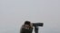 FILE - A South Korean army soldier watches the North Korea side from the Unification Observation Post in Paju, South Korea, near the border with North Korea, Dec. 25, 2019. 