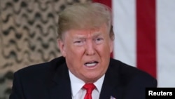 Polish President Andrzej Duda embraces Ukraine&#39;s President Volodymyr Zelenskiy during a session of Ukrainian parliament in Kyiv as Russia&#39;s attack on Ukraine continues.