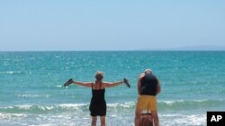 German tourists arrive at the beach of Palma de Mallorca, Spain, June 15, 2020.