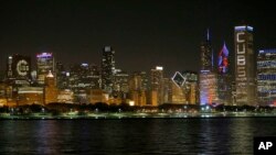 FILE - A nighttime view of the Chicago skyline, after the city's Cubs won the World Series in 2016. 