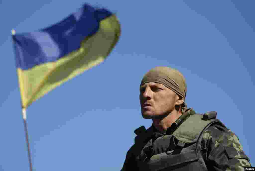 A Ukrainian serviceman stands at a checkpoint near the town of Horlivka in eastern Ukraine, Sept.&nbsp;18, 2014.