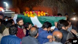 Relatives, friends carry the body of a Pakistani soldier killed in a gun battle with militants in country's volatile southwestern Baluchistan province; Faisalabad, Pakistan, Feb. 3, 2022.
