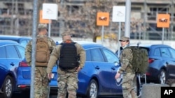 U.S. Army officers after arrival at the Rzeszow-Jasionka airport in southeastern Poland, on Saturday, Feb. 5, 2022, coming from Wiesbaden, Germany where a U.S. Army administration garrison is based.