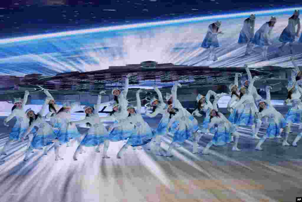 Dancers perform during the opening ceremony of the 2022 Winter Olympics, Feb. 4, 2022, in Beijing. 