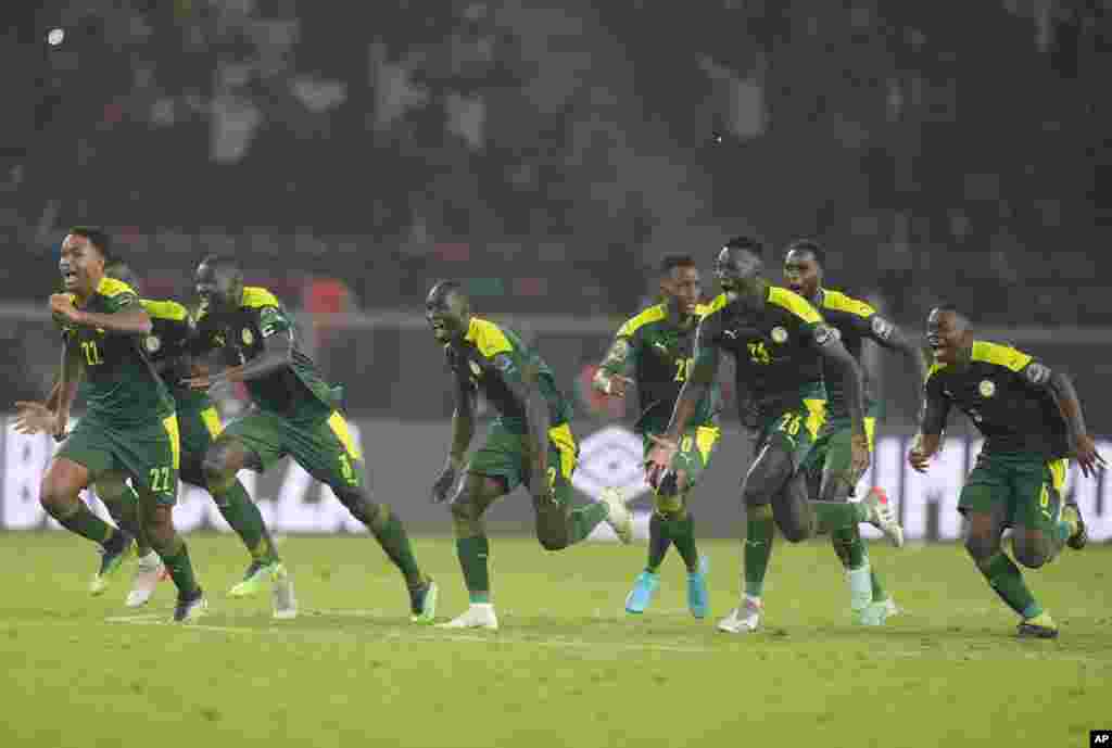 Senegal&#39;s players celebrate after winning the final soccer match against Egypt, Feb. 6, 2022.
