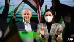 Presidential candidate Jose Maria Figueres of the National Liberation Party (PLN) stands next to his wife Cinthia Berrocal Quirós at his campaign headquarters after the polls closed in San Jose, Costa Rica, Feb. 6, 2022.
