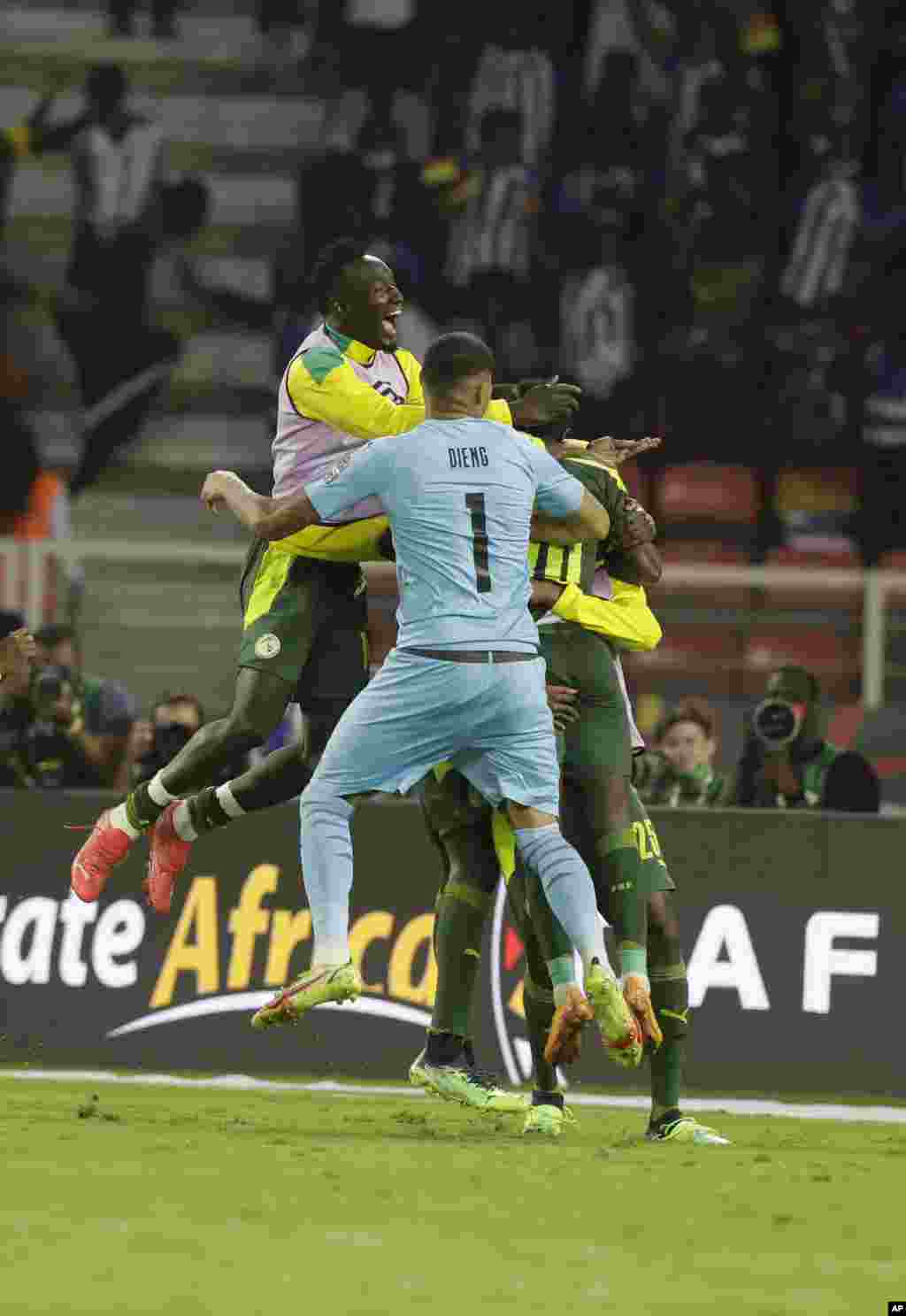Senegal&#39;s players celebrate after winning the final soccer match against Egypt, Feb. 6, 2022.