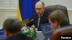 Ukraine's new prime minister Arseny Yatseniuk chairs a meeting in Kyiv, Feb. 27, 2014.