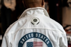 Olympian Peter Westbrook wears the official uniform of the U.S. team flag bearer for the Tokyo Olympics, which features a personal cooling system with a fan at the back of the neck, in New York, July 14, 2021.