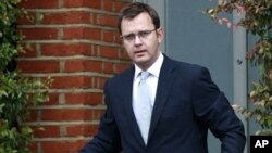 Former News of the World newspaper editor and Prime Minister David Cameron's director of communications, Andy Coulson, is seen leaving his home in Dulwich, southeast London (file photo)