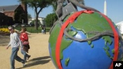Globes showing environmental challenges are lining the National Mall for Earth Day activities.