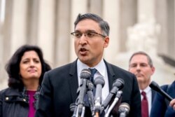 FILE - This April 25, 2018 file photo shows attorney Neal Katyal speaking to members of the media outside the Supreme Court in Washington.