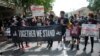 Para demonstran berpawai di Washington, DC, memperingati "Juneteenth", 19 Juni 2020.