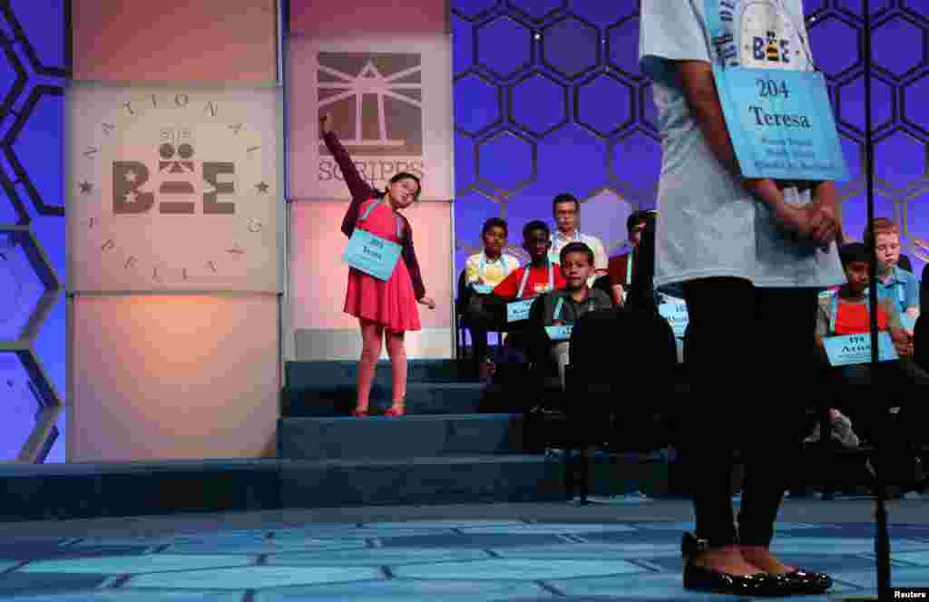 Yena Park, 10, stretches while waiting for her turn to compete in the second round of the 92nd annual Scripps National Spelling Bee in National Harbor, Maryland, May 28, 2019.