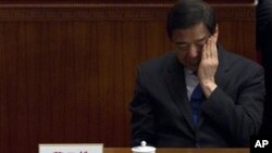 Women show their inked fingers after casting their votes at a polling station in Cairo. Egyptians are voting on a draft for their country&#39;s new constitution.