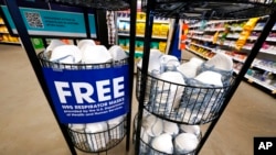 A display of free N95 respirator masks, provided by the US Department of Health and Human Services, sits outside the pharmacy at this Jackson, Miss., Kroger grocery store Feb. 2, 2022. 
