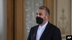 Iran's Foreign Minister Hossein Amirabdollahian speaks at a joint press briefing with his Irish counterpart Simon Coveney, in Tehran, Iran, Feb. 14, 2022. 