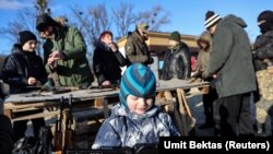 Residents take part in a military exercise for civilians conducted by a far-right radical group, Right Sector, amid threat of Russian invasion in Kyiv on February 13, 2022. (Umit Bektas/Reuters)