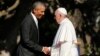 U.S. President Barack Obama, left, greets Pope Francis upon his arrival at the White House in Washington, Sept. 23, 2015. 