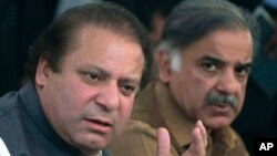 FILE - In this Feb. 17, 2008 file photo, Pakistan's Prime Minister Nawaz Sharif, left, and his brother Shahbaz Sharif address a news conference in Lahore, Pakistan. Sharif has announced that he will set up an independent judicial commission to probe whether his family is involved in illegal overseas investments after reports based on documents leaked from a Panama-based law firm indicated his sons owned several offshore companies.