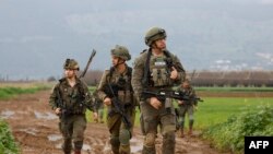 Israeli soldiers patrol an area near the northern kibbutz of Kfar Blum close to the border with Lebanon after Hezbollah said its fighters carried out an aerial attack with two drones against an Israeli air defense system site in the border region on Janua